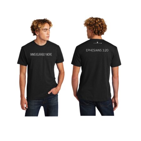 Male model wearing black T-shirt that reads Immeasurably More