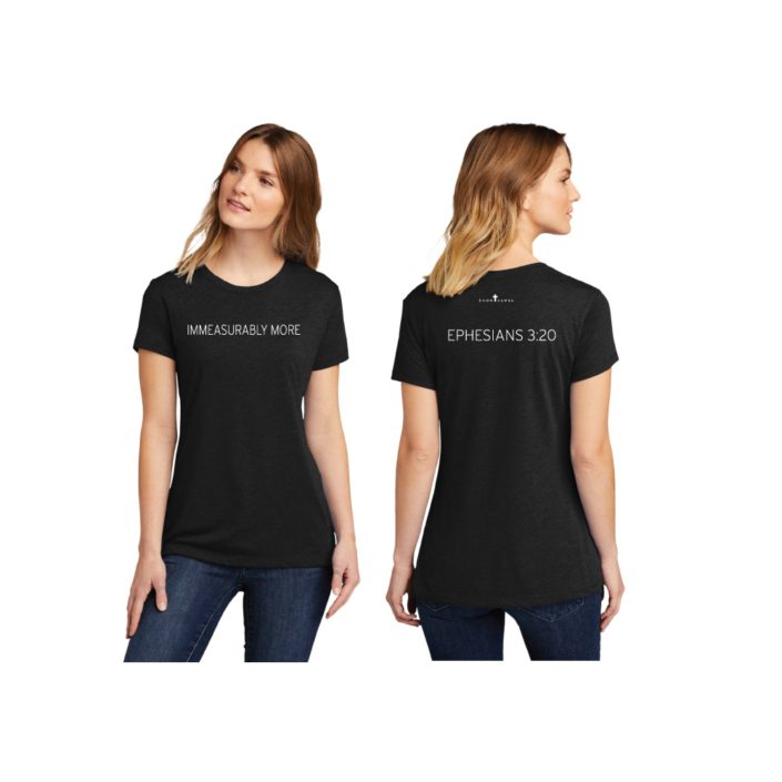 Female model wearing black T-shirt that reads Immeasurably More