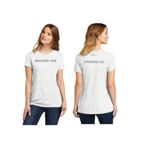 Female model wearing white T-shirt that reads Immeasurably More